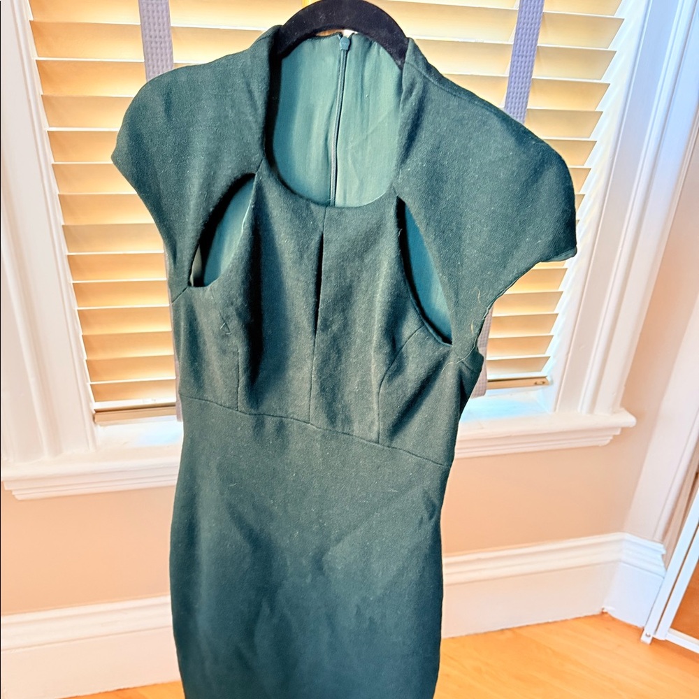 Forrest green Monique Lhuillier dress. Size 6. Wool;w/ cute cutouts in the front